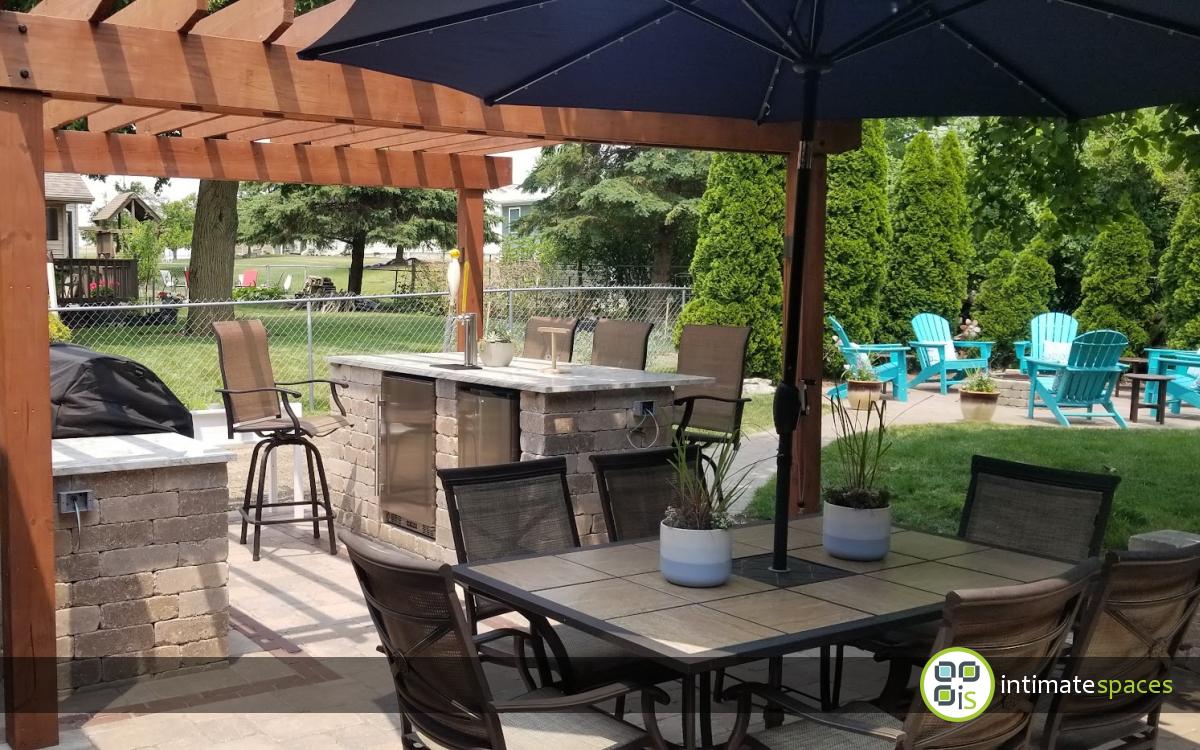 Outdoor living space featuring a galley kitchen and bar