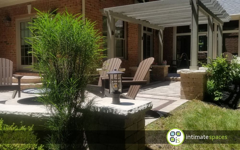 Paver patio, pergola, fire pit, lighting, screened porch and landscaped outdoor living space in Newark, Oh
